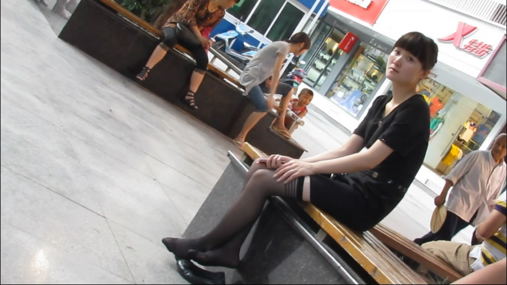Pretty girl wearing nylon feet and flatshoes